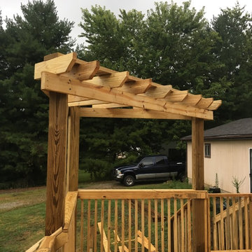Small deck and decorative pergola; customer request for lattice.