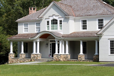 Large arts and crafts gray two-story wood house exterior photo in New York