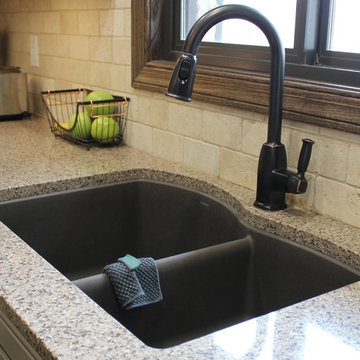 Farmhouse kitchen Taupe Painted Cabinets,Quartz Tops, and Dark Island