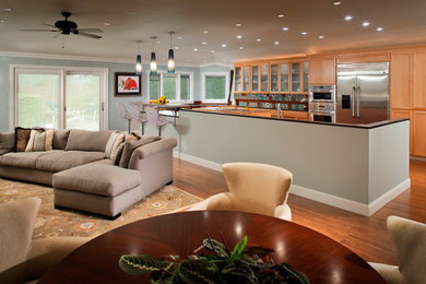 Design ideas for a large transitional open concept family room in San Francisco with medium hardwood floors.