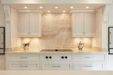 Traditional grey and white kitchen in Cambridgeshire with white cabinets, granite worktops, multi-coloured splashback, granite splashback, an island, multicoloured worktops and a feature wall.