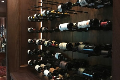 Wine cellar - transitional wine cellar idea in New York