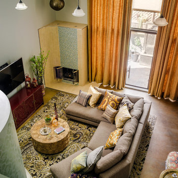 Midcentury Moroccan Loft Living Room and Fireplace | Kimball Starr Interior Desi