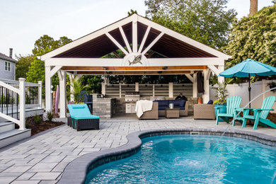 Beach style backyard privacy pool photo in Other