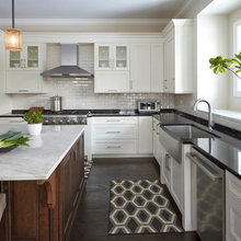 white cabinets/stainless appliances/dark counters