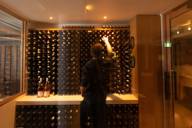 This is an example of a modern wine cellar in Sunshine Coast.