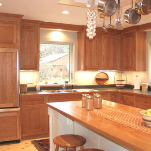 Kitchen pantry pictures - Inspiration for a galley medium tone wood floor kitchen pantry remodel in Burlington with recessed-panel cabinets, medium tone wood cabinets, granite countertops and an island