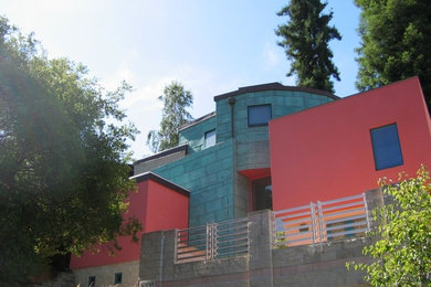 This is an example of a contemporary two-storey multi-coloured house exterior in San Francisco with mixed siding.