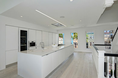 Inspiration for a large scandinavian single-wall open plan kitchen in Other with quartz benchtops and with island.