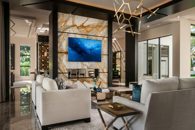 Example of a trendy open concept gray floor family room design in Miami with a two-sided fireplace, a tile fireplace and a wall-mounted tv