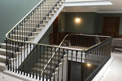 Staircase balustrade in steel and brass
