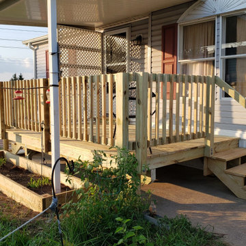 Low level pressure treated deck with flower box