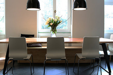 Mid-sized trendy light wood floor kitchen/dining room combo photo in Essen with white walls and no fireplace