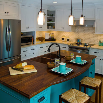 Farmhouse Kitchen with Walnut countertops on blue cabinetry