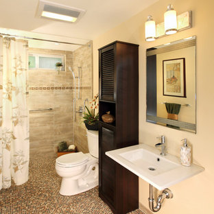 Example of a mid-sized classic 3/4 porcelain tile mosaic tile floor and beige floor bathroom design in Los Angeles with louvered cabinets, dark wood cabinets, a two-piece toilet, beige walls and a wall-mount sink