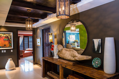 Hallway - large tropical marble floor hallway idea with gray walls