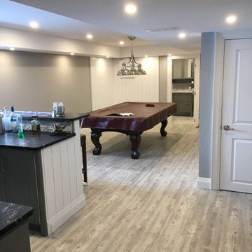 Basement Renovation with Entertainment and Exercise Space
