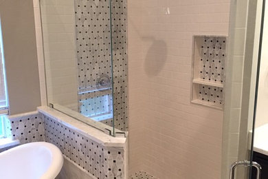 Bathroom - mid-sized traditional master white tile and porcelain tile porcelain tile bathroom idea in Dallas with an undermount sink, recessed-panel cabinets, black cabinets, marble countertops, a one-piece toilet and gray walls