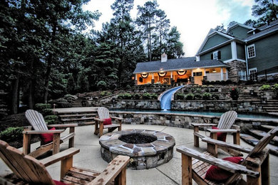 Example of a large classic side yard concrete and custom-shaped natural water slide design in Atlanta