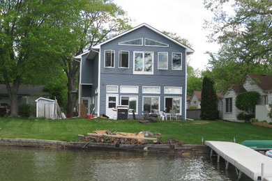 Trendy blue two-story exterior home photo in Detroit