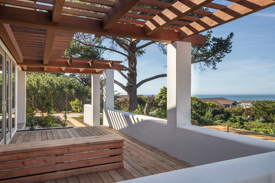 Deck - mid-sized coastal side yard deck idea in San Francisco with a pergola