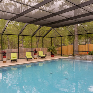 Patio with Fireplace with Screened Pool Enclosure
