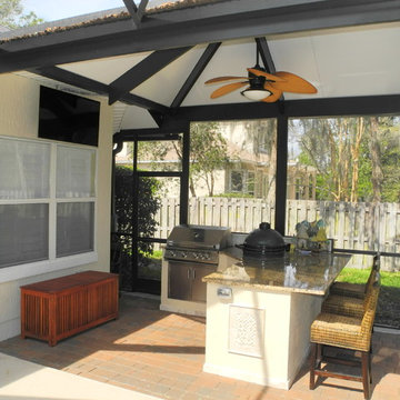 Outdoor kitchen with extended roof.