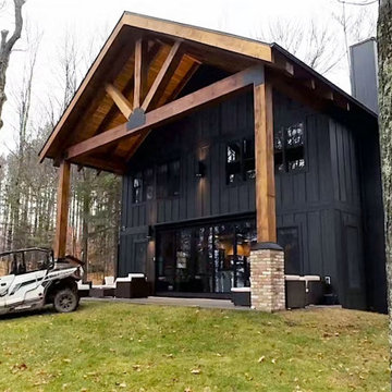 Modern Black Cabin Exterior with Timber Entry