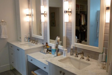 Inspiration for a bathroom remodel in Toronto with white cabinets and granite countertops
