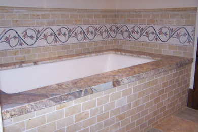 Bathroom - rustic beige tile and subway tile slate floor bathroom idea in Other with granite countertops and an undermount tub