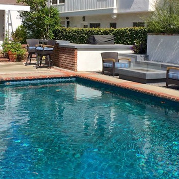 Drought tolerant landscape with new barbeque and fire table.