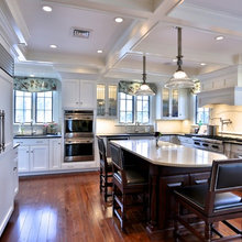 Kitchen With White Cabinets And Coffered Ceiling