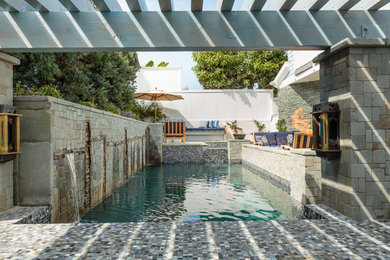 Design ideas for a mid-sized modern backyard patio in Orange County with a gazebo/cabana.