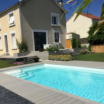 Aménagement des contours d'une piscine avec une terrasse en vois composite