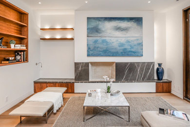 Mid-sized trendy formal and open concept light wood floor living room photo in Orange County with white walls, no fireplace and no tv