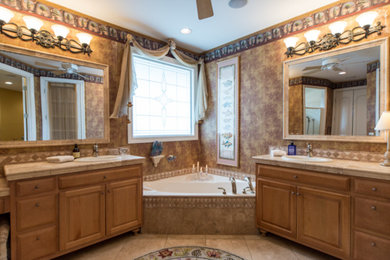 Bathroom - large mediterranean master beige tile and ceramic tile ceramic tile and beige floor bathroom idea in Phoenix with raised-panel cabinets, light wood cabinets, beige walls and an integrated sink