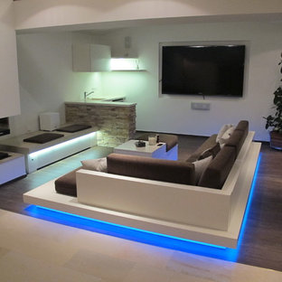 Inspiration for a mid-sized mediterranean enclosed home theater remodel in Berlin with white walls and a projector screen