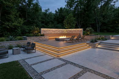 Small trendy backyard patio photo in Los Angeles with a fire pit and decking