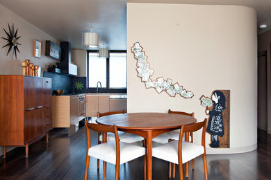 This is an example of a small midcentury dining room in Melbourne.