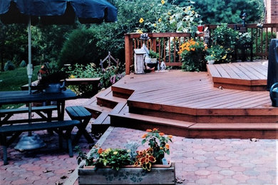 Photo of a mid-sized arts and crafts backyard deck in Cleveland.