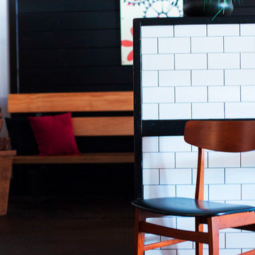 Plywood bench and black wood slat wall