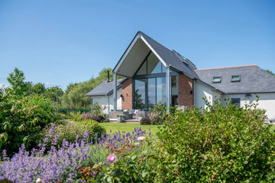 Contemporary house exterior in Other.