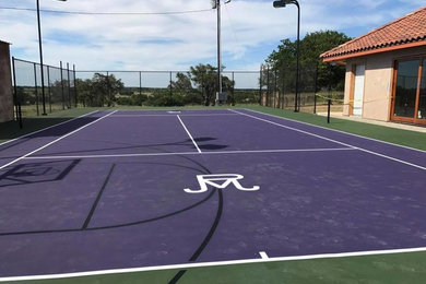 This is an example of a large traditional partial sun backyard concrete paver landscaping in Austin for summer.