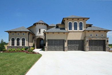 Example of a large two-story mixed siding exterior home design in Other
