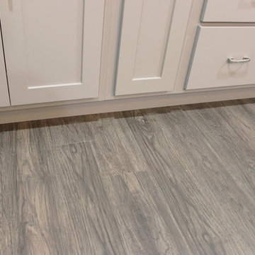 White Upper Cabinet and Gray Base Cabinet Kitchen With Quartz Counters