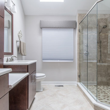 Full Length Glass Walls with Dual Rain Shower Fixtures and Built-In Shower Bench