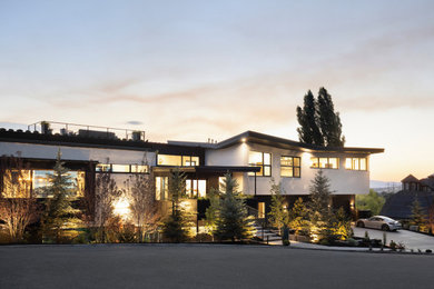 Example of a mid-century modern exterior home design in Salt Lake City