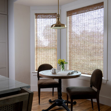 Breakfast nook adjoining the kitchen with woven shades