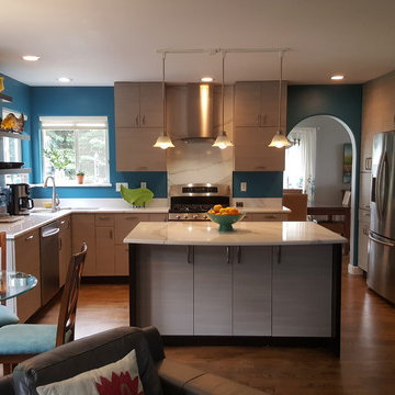 This is a two tone updated kitchen with efficient use of space & feature points