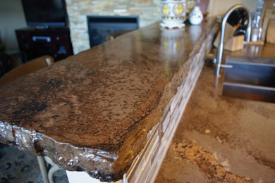 Inspiration for a rustic eat-in kitchen remodel in Denver with white cabinets and concrete countertops